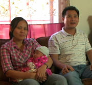 video - A couple with their baby at home