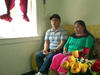 Bhutanese couple at home on their couch