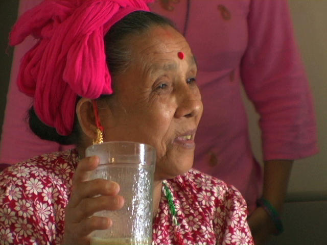 Bhutanese woman wearing a pink headwrap