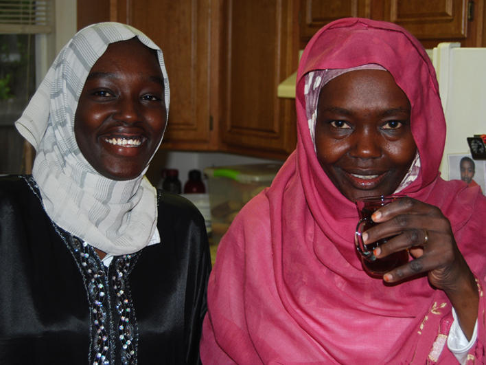 Two Darfuri women socializing in the U.S.