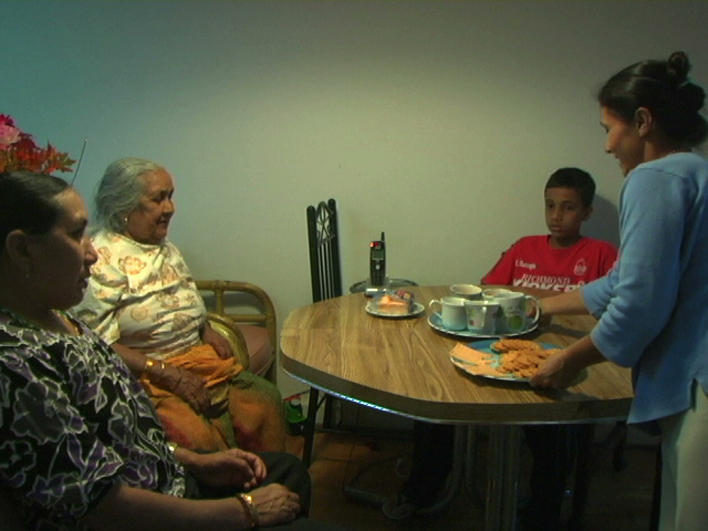 A Bhutanese family sitting down to eat