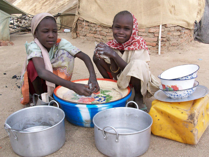 Darfuri girls doing chores