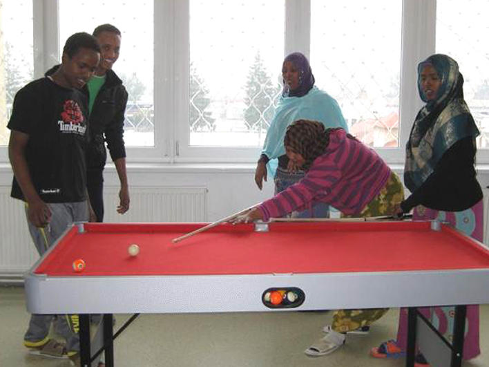 Somali refugees playing pool during a CO session break