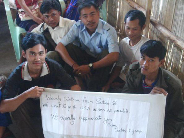 Refugees holding an appreciative note