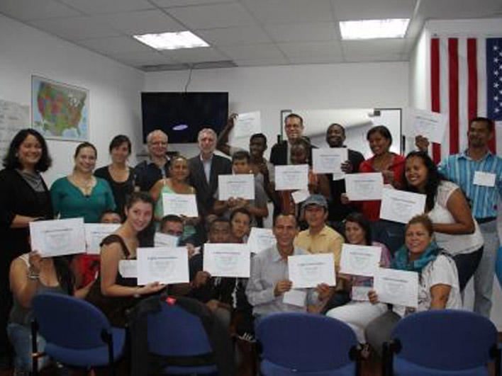 Smiling participants, trainers, and special guests at conclusion of session in Quito, Ecuador